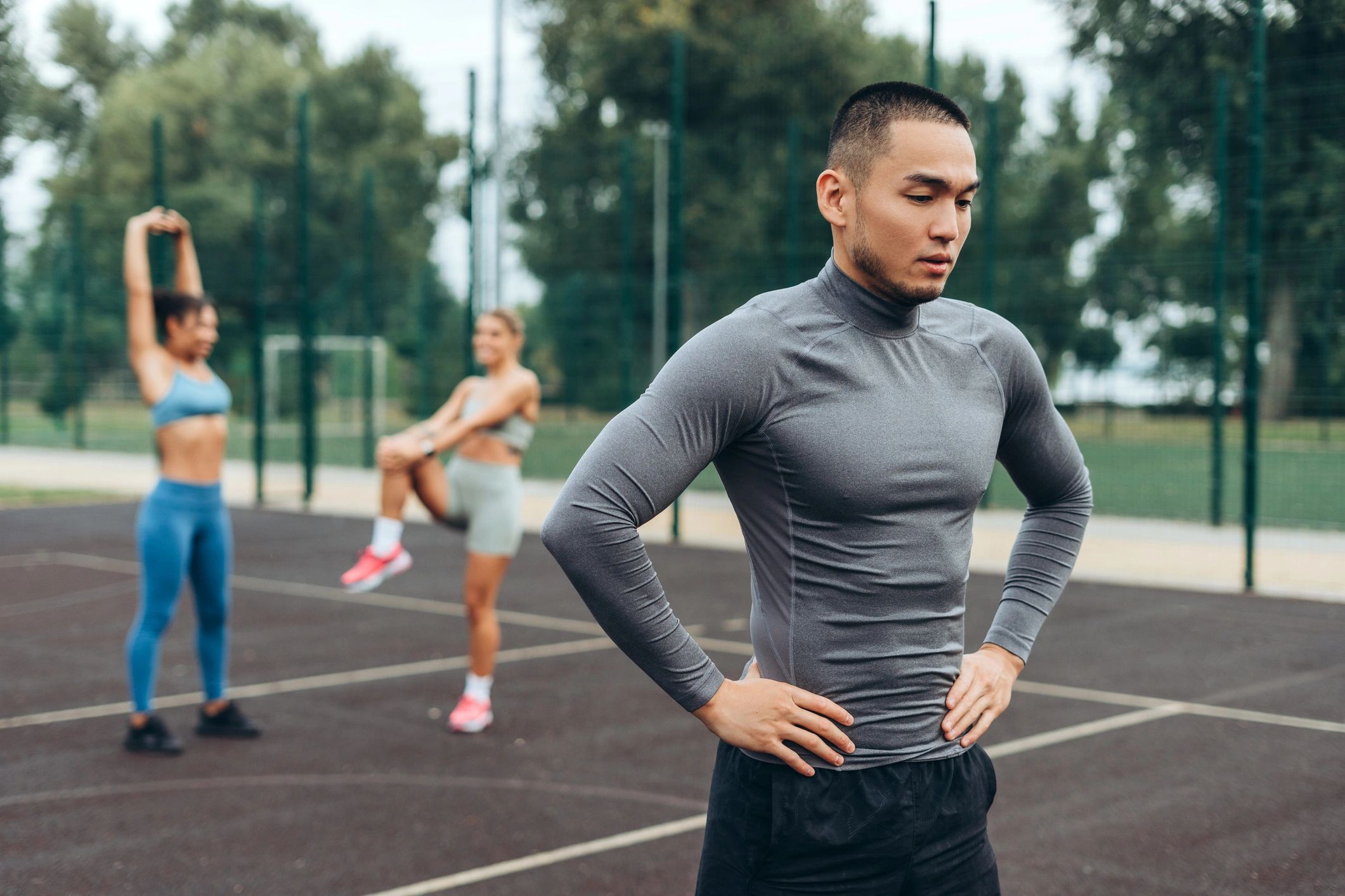 Athlete stretching and preparing for training outdoors