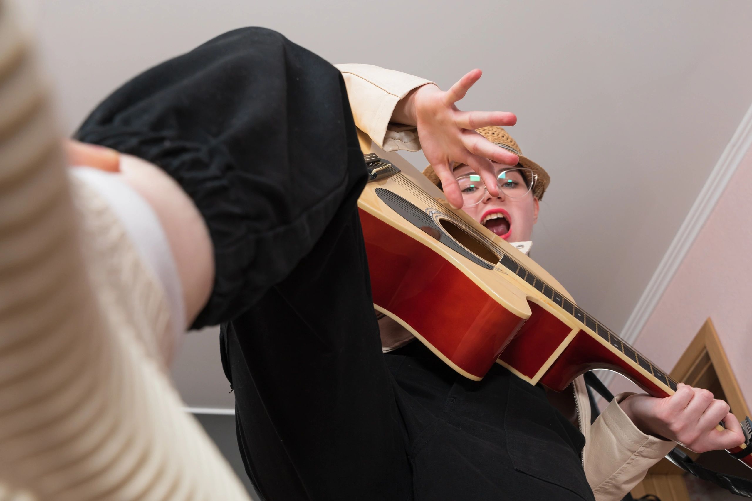 Musician performing on stage with guitar