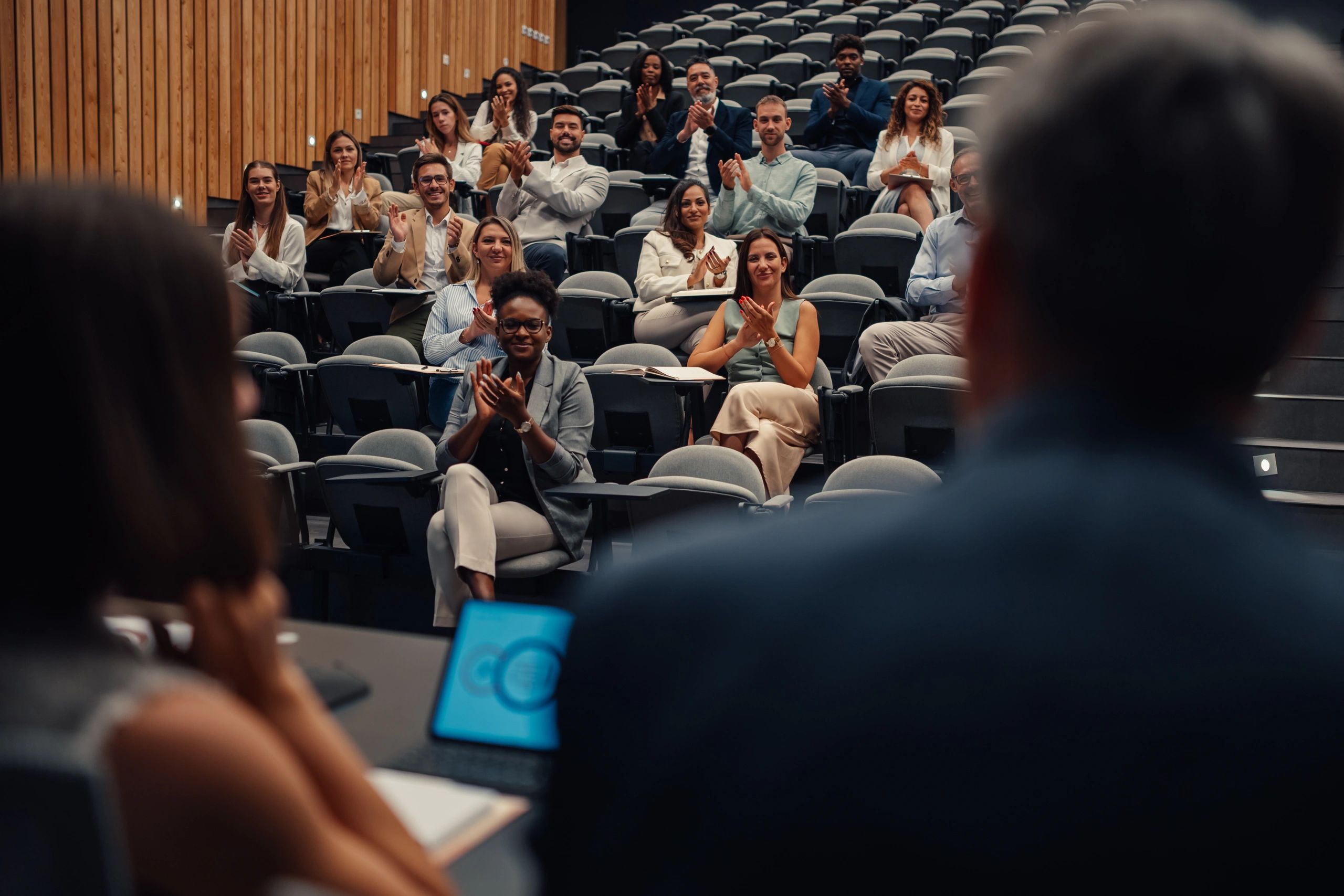 Workshop audience applauding a presentation